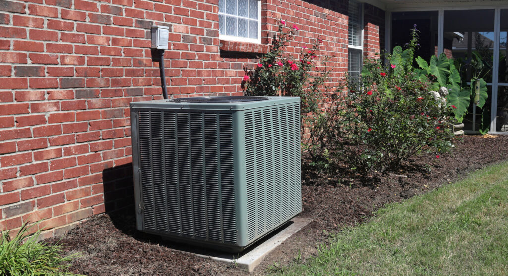 heating technician inspecting residential furnace system